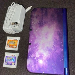 Nintendo 3DS, charger, Pokémon moon, & ultra sun.